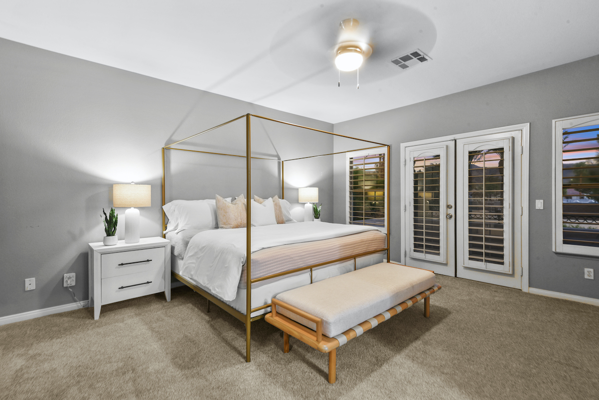 Case Studies 19 | Luxury Home Staging & Design in Las Vegas Elegant Summerlin staged home bedroom with a modern canopy bed and cozy lighting. | Utopia Luxury Home Staging & Design