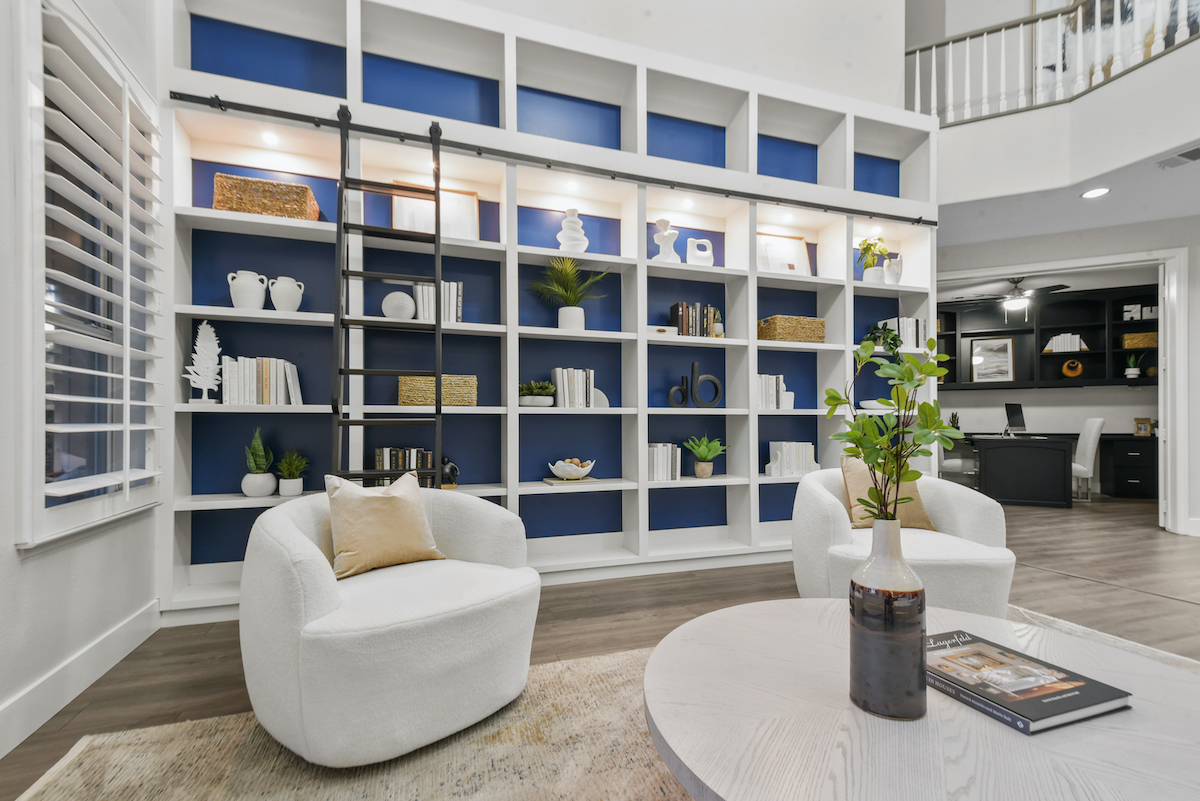 Case Studies 13 | Luxury Home Staging & Design in Las Vegas Stylish vacant home staging design with elegant shelving and cozy seating. | Utopia Luxury Home Staging & Design