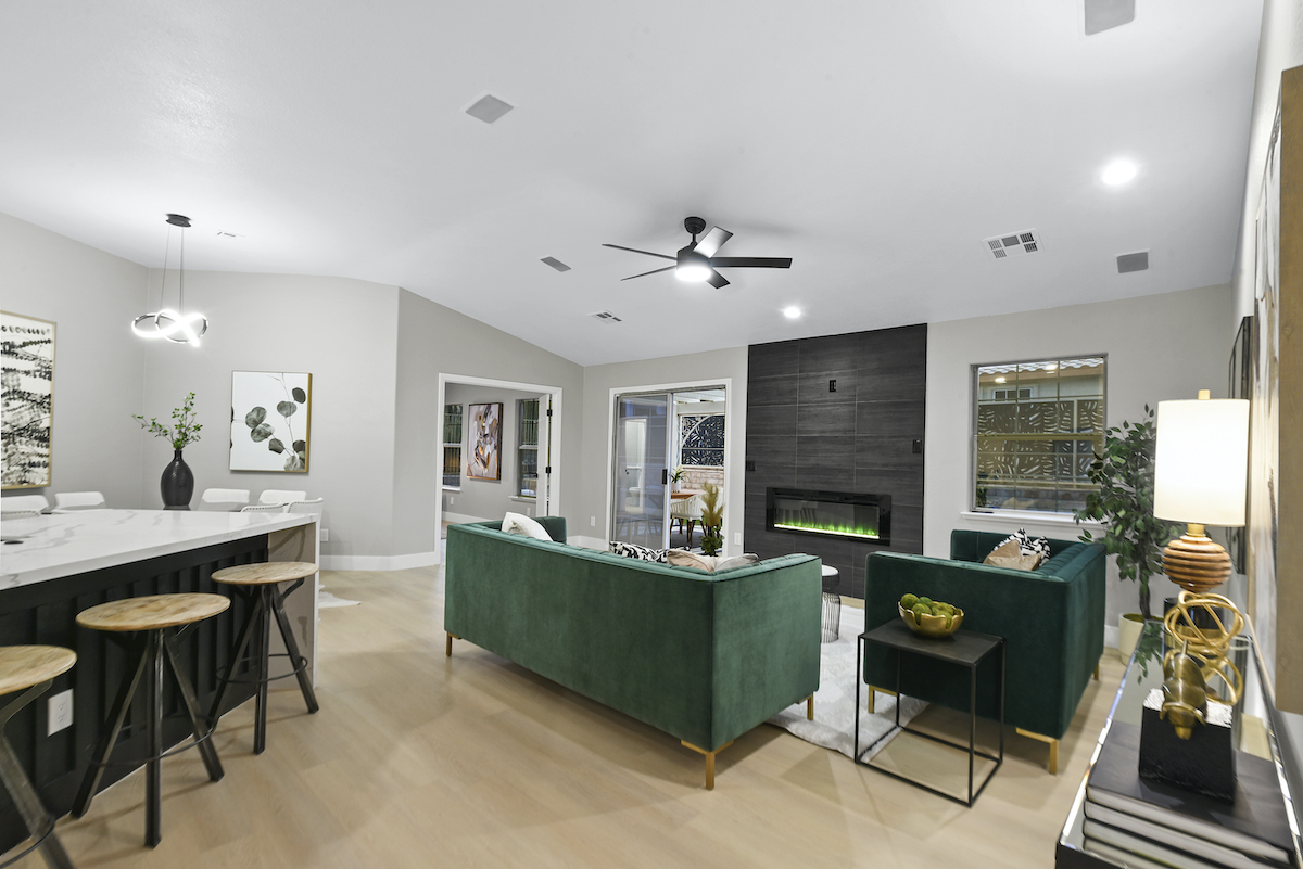 Case Studies 30 | Luxury Home Staging & Design in Las Vegas Sophisticated Las Vegas home staging with elegant green sofa and modern decor | Utopia Luxury Home Staging & Design