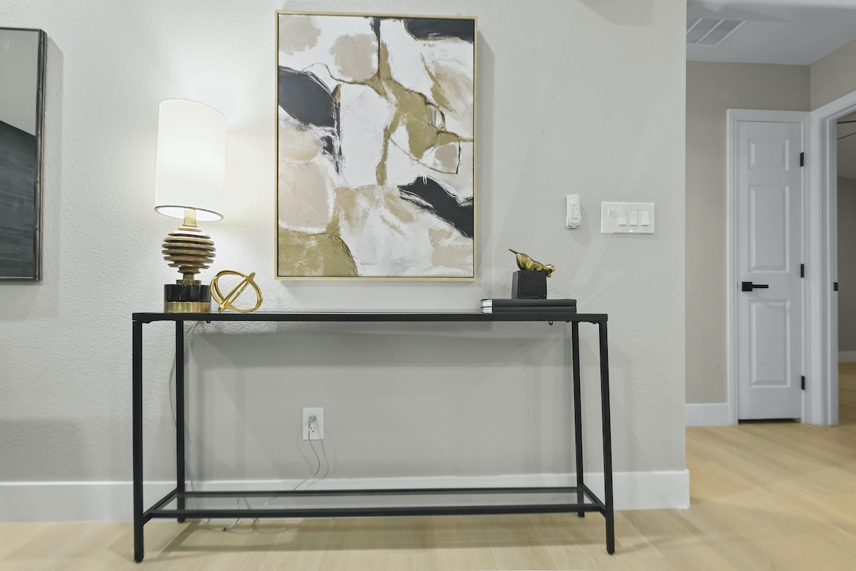 Case Studies 28 | Luxury Home Staging & Design in Las Vegas Contemporary entryway in a Henderson luxury staging with modern artwork. | Utopia Luxury Home Staging & Design