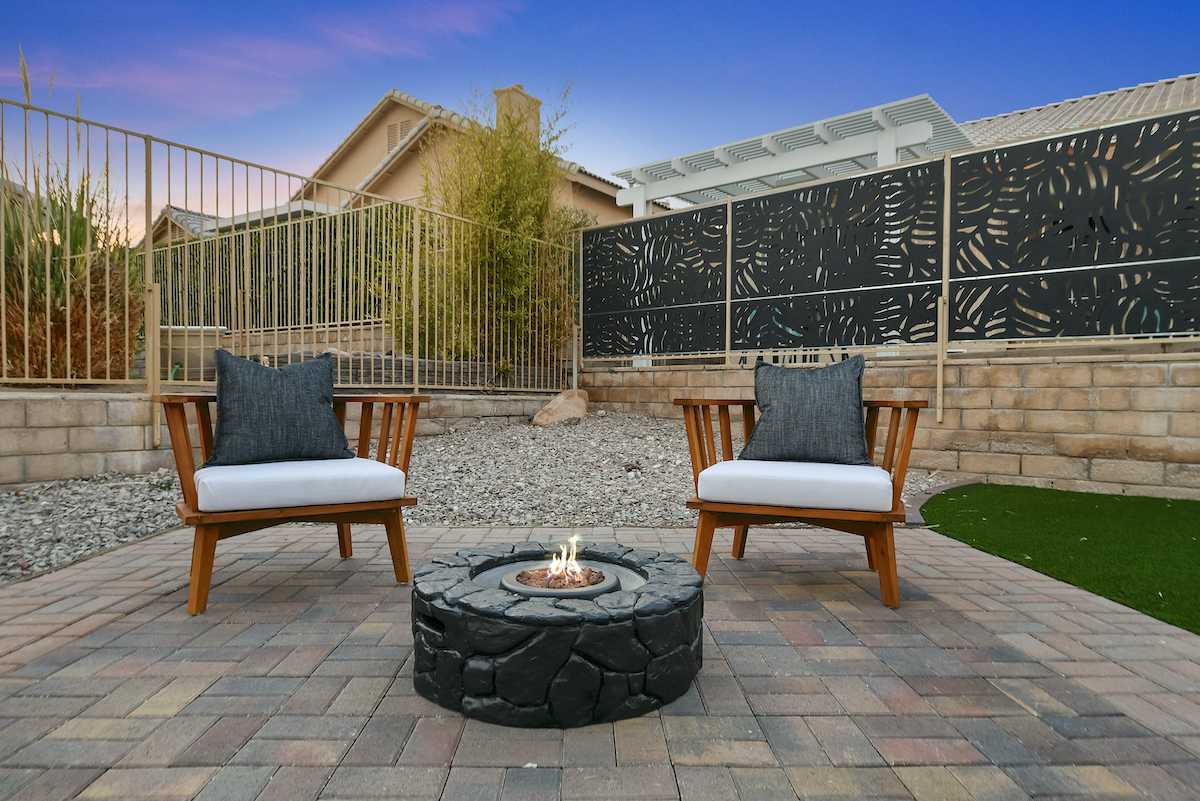Case Studies 34 | Luxury Home Staging & Design in Las Vegas Modern patio with elegant seating and a central fire pit in Las Vegas. | Utopia Luxury Home Staging & Design