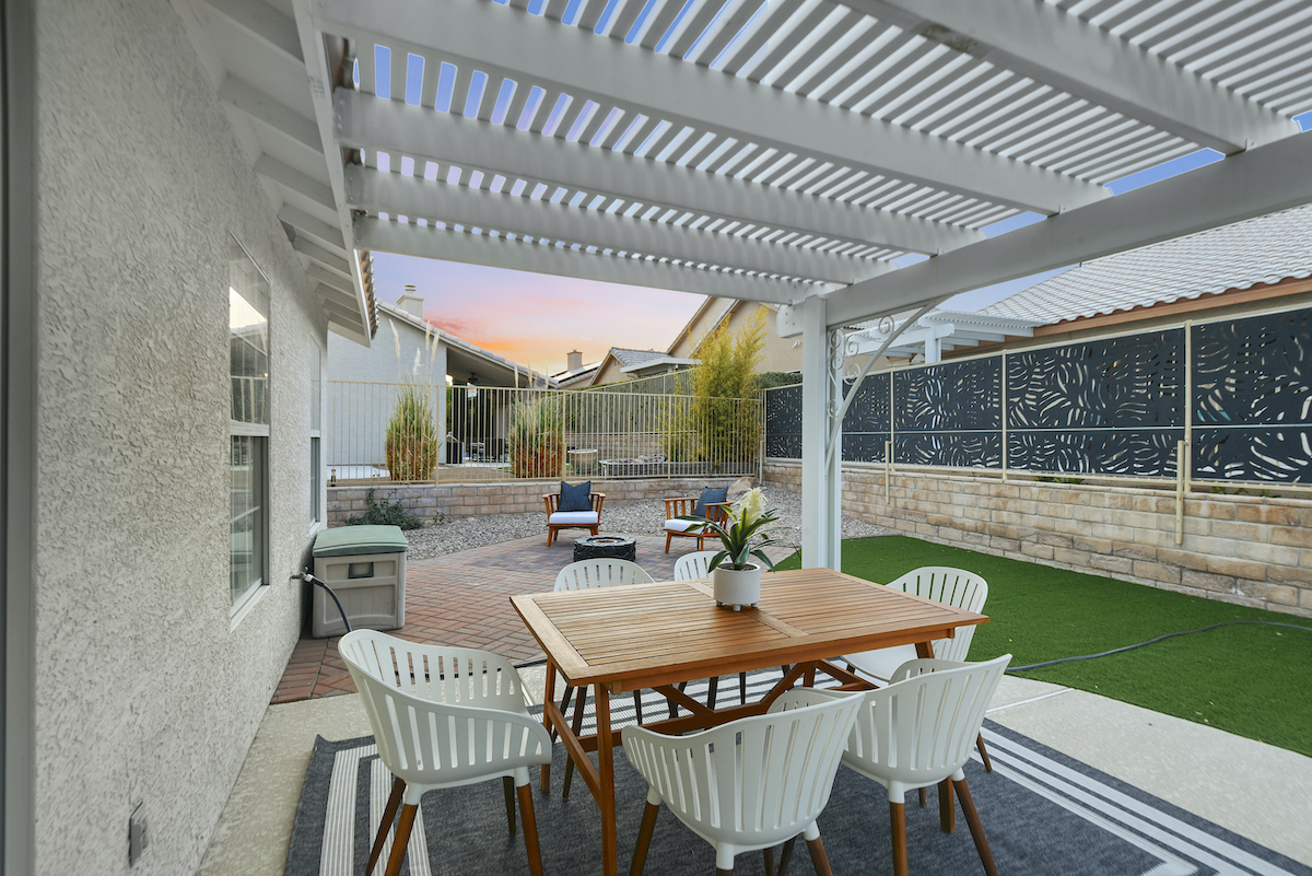 Case Studies 33 | Luxury Home Staging & Design in Las Vegas Outdoor dining under pergola enhances Las Vegas home staging appeal. | Utopia Luxury Home Staging & Design