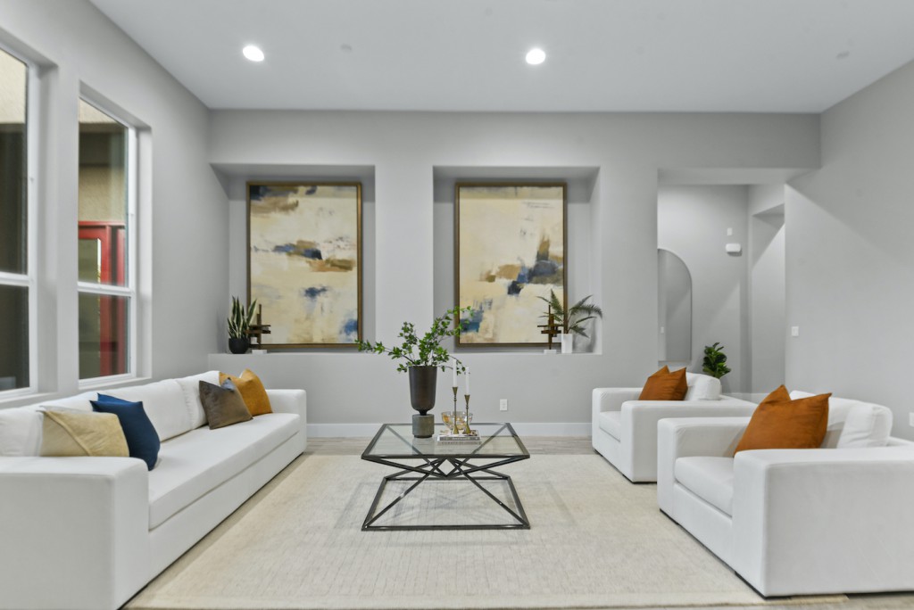 Professionally staged Las Vegas living room with white sofas ready for spring sale