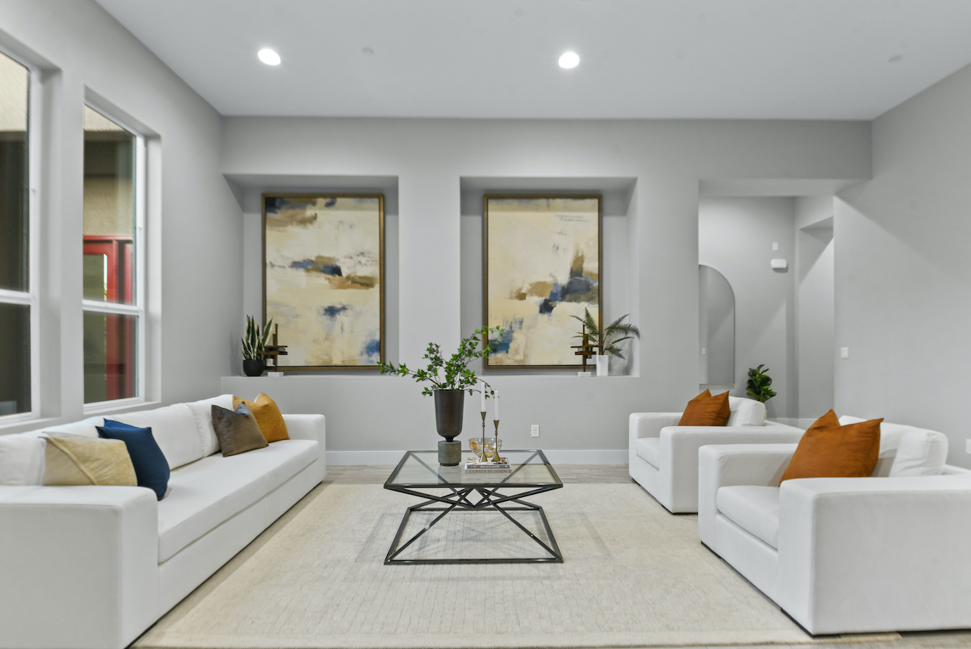 Professionally staged Las Vegas living room with white sofas ready for spring sale