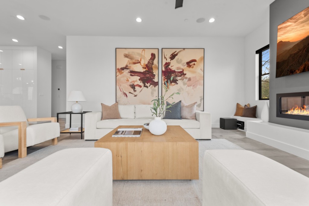 Professionally staged Las Vegas living room ready for spring selling season with contemporary design and linear fireplace