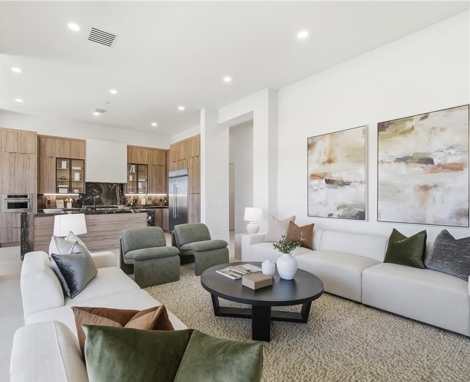 Las Vegas home staging — Family Room at 18 Brookridge Dr with modular sofa and abstract art