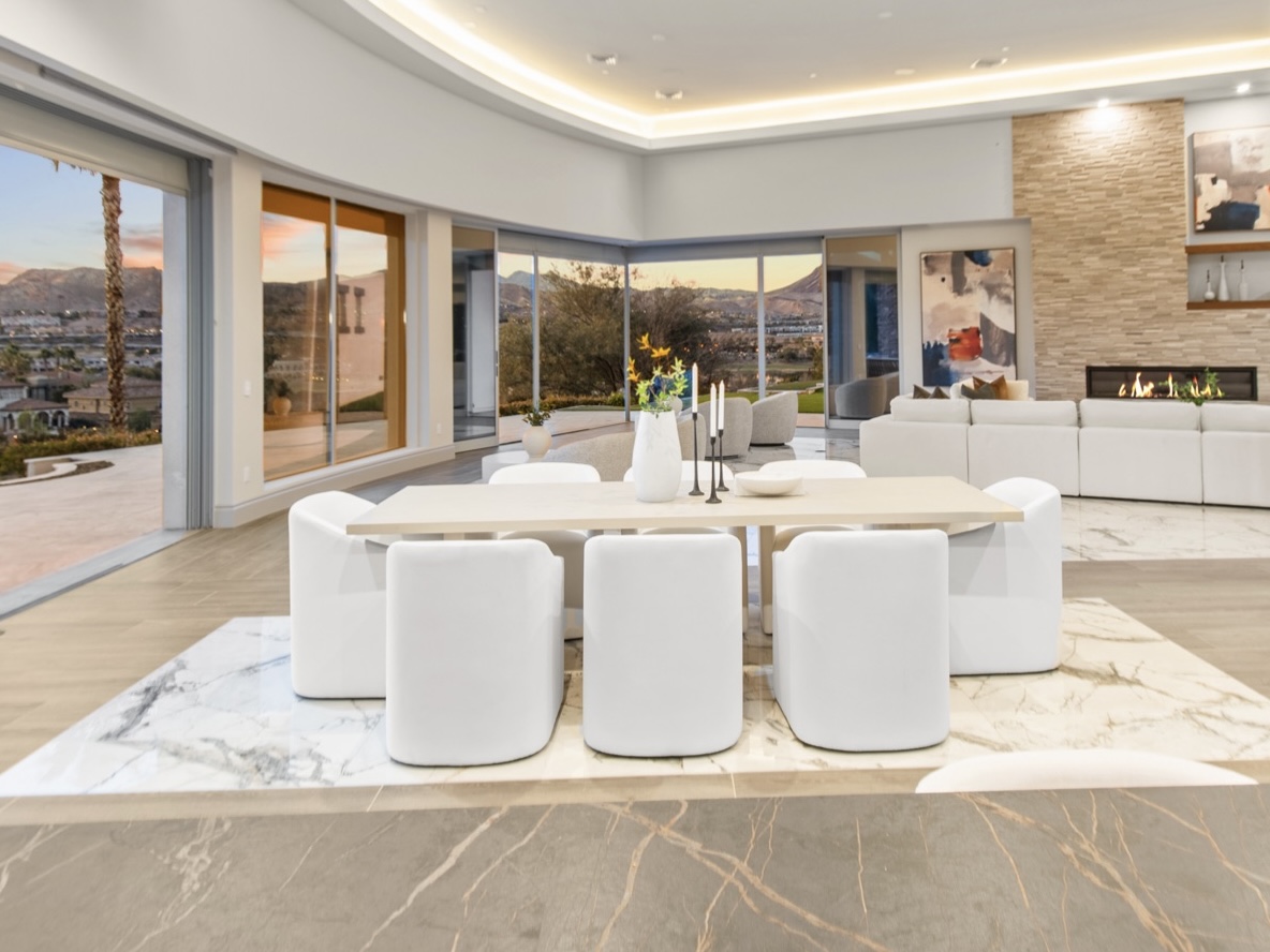 How Home Staging in Las Vegas Protects Your Reputation as a Listing Agent 1 | Luxury Home Staging & Design in Las Vegas Professionally staged Las Vegas great room and dining area with mountain view — the kind of listing photo that compounds an agent's brand